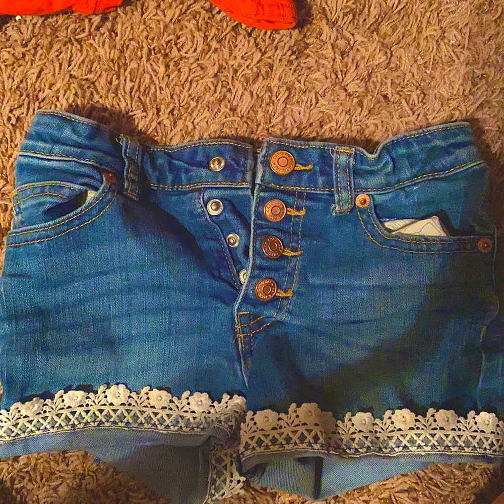 Cute jean shorts with white floral at the bottom